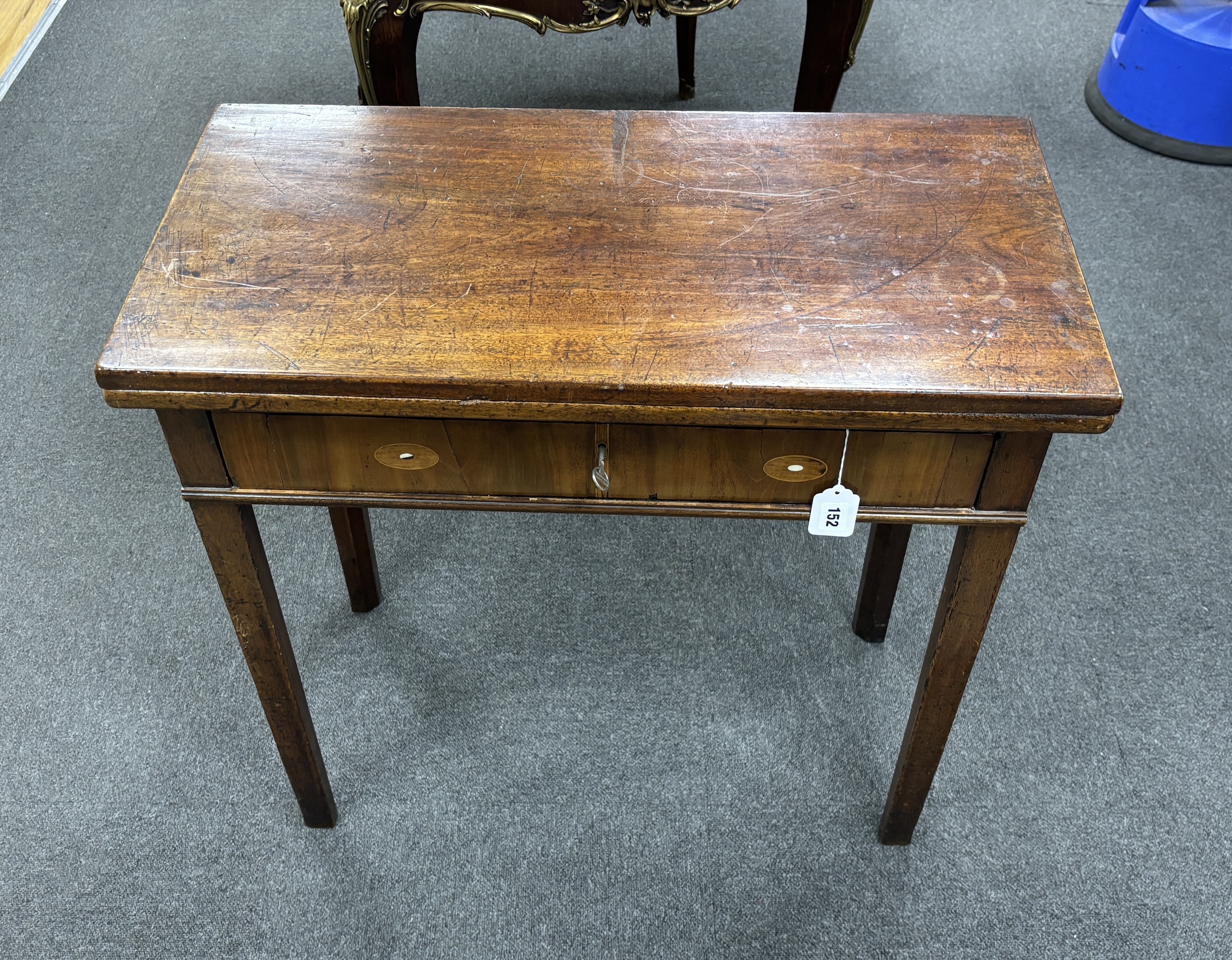 A George III rectangular mahogany folding tea table, width 75cm, depth 37cm, height 72cm.